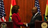 US Vice President Kamala Harris (left) shakes hands with President of Ghana Nana Akufo-Addo during a press conference after their bilateral meeting in Accra, Ghana, on March 27, 2023. (Photo by Nipah Dennis / AFP)