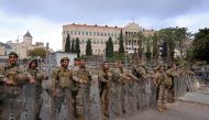 Soldiers stand guard outside the government palace during a demonstration by retired Lebanese army and security forces veterans demanding inflation-adjustments to their pensions, in Beirut on March 30, 2023. (Photo by JOSEPH EID / AFP)