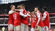 Arsenal's Swiss midfielder Granit Xhaka (third left) celebrates with teammates after scoring their fourth goal during the English Premier League football match between Arsenal and Leeds United at the Emirates Stadium in London on April 1, 2023. (Photo by Glyn KIRK / AFP) 