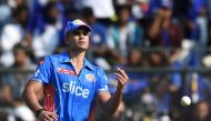 Mumbai Indians' Arjun Tendulkar fields the ball during the Indian Premier League (IPL) Twenty20 cricket match between Kolkata Knight Riders and Mumbai Indians at the Wankhede Stadium in Mumbai on April 16, 2023. (Photo by Punit Paranjpe / AFP)
