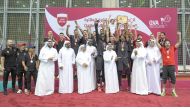 Al Rayyan players and officials celebrate after receiving the League championship trophy from President of the Qatar and West Asia Volleyball Associations Ali Ghanem Al Kuwari.