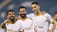 Qatar SC players celebrate after wining the match.