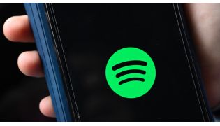 This file illustration photo taken on January 23, 2023 shows the company logo of Swedish music streaming giant Spotify on a smartphone in Berlin. Photo by Tobias Schwarz / AFP