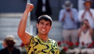Spain's Carlos Alcaraz celebrates beating Croatia's Borna Coric during their 2023 ATP Tour Madrid Open tennis tournament singles semi-final match at Caja Magica in Madrid on May 5, 2023. (Photo by Pierre-Philippe Marcou / AFP)
