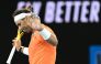 Spain's Rafael Nadal reacts as he plays against USA's Mackenzie McDonald during their men's singles match on day three of the Australian Open tennis tournament in Melbourne on January 18, 2023. (Photo by MANAN VATSYAYANA / AFP)