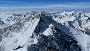In this file photo taken on May 31, 2021 the Himalayan Range is seen from the summit of Mount Everest (8,849 metres) in Nepal. (Photo by Lakpa SHERPA / AFP)  