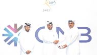 Officials of QNB facilitating the graduates of its National Kawader Malia Program.