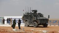 In this picture taken on May 24, 2023, a Turkish military vehicle is pictured during the inauguration of a Turkish-funded housing complex for the internally displaced, in the area of Ghandoura, in the Syrian countryside of Jarablus. (Photo by Bakr Alkasem / AFP)