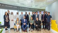 QFC officials and founders of Southeast Asian startups pose for a group photo.