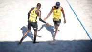 Qatar's Cherif Younousse and Ahmed Tijan celebrate after scoring a point during the World Beach Pro Tour’s second Elite16 event in Ostrava, Czechia, yesterday.