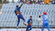 Sri Lanka's Dushmantha Chameera (L) celebrates after taking the wicket of Afghanistan's Rahmanullah Gurbaz (R) during the second one-day international (ODI) cricket match between Sri Lanka and Afghanistan at the Mahinda Rajapaksa International Cricket Stadium in Hambantota on June 4, 2023. (Photo by Ishara S. Kodikara / AFP)