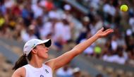 Poland's Iga Swiatek serves to Brazil's Beatriz Haddad Maia during their women's singles semi-final match on day twelve of the Roland-Garros Open tennis tournament at the Court Philippe-Chatrier in Paris on June 8, 2023. (Photo by Emmanuel DUNAND / AFP)
