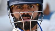 India's Virat Kohli prepares to walk out to bat ahead of play on day 5 of the ICC World Test Championship cricket final match between Australia and India at The Oval, in London, on June 11, 2023. (Photo by Glyn Kirk / AFP)