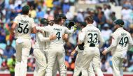 Australia's Nathan Lyon (C) celebrates with teammates Australia's Travis Head (2L) and Australia's Pat Cummins (C/R) and others after the dismissal of India's Mohammed Shami at The Oval, in London, on June 11, 2023. (Photo by Glyn KIRK / AFP)