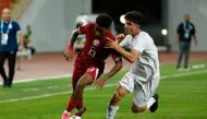 Action during Qatar’s match against Iran on Monday.  