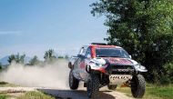 Qatar's Nasser Saleh Al Attiyah competes during the Italian Baja. INSET: Al Attiyah after finishing a stage. 