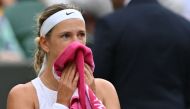 Belarus' Victoria Azarenka uses a towel during a break in play against Ukraine's Elina Svitolina during their women's singles tennis match on the seventh day of the 2023 Wimbledon Championships at The All England Tennis Club in Wimbledon, southwest London, on July 9, 2023. Photo by Glyn KIRK / AFP