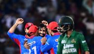 Afghanistan's Karim Janat (C) celebrates with teammates after taking a hat-trick during the first Twenty20 international cricket match between Bangladesh and Afghanistan at the Sylhet International Cricket Stadium in Sylhet on July 14, 2023. (Photo by Munir uz ZAMAN / AFP)