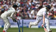 Australia's wicket keeper Alex Carey (L) breaks the stumps but England's Zak Crawley (R) has safely made his ground on day two of the fourth Ashes cricket Test match between England and Australia at Old Trafford cricket ground in Manchester, north-west England on July 20, 2023. (Photo by Oli SCARFF / AFP) 