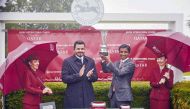 Qatar Olympic Committee President H E Sheikh Joaan bin Hamad Al Thani presented the winner's trophy to the representative of Al Shaqab Racing - owner of Al Ghadeer who clinched the Qatar International Stakes at the Qatar Goodwood Festival at Goodwood Racecourse, yesterday. Pictures: Dominic James