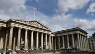 (Files) Visitors gather outside the The British Museum in central London on August 24, 2018. (Photo by Daniel Leal / AFP)
