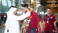 The bronze-winning Qatar volleyball team received a rousing welcome on return.