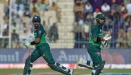 Pakistan's captain Babar Azam (L) and Iftikhar Ahmed run between the wickets during the Asia Cup 2023 cricket match between Pakistan and Nepal at the Multan Cricket Stadium in Multan on August 30, 2023. (Photo by Asif HASSAN / AFP)
