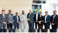 IBPC Qatar and GCBQ officials pose for a group photo.