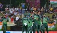 Pakistan's Shaheen Shah Afridi (3R) celebrates with teammates after taking the wicket of India's Virat Kohli (not pictured) in Kandy on September 2, 2023. (Photo by Ishara S. Kodikara / AFP)