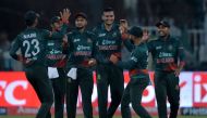 Bangladesh's players celebrate after winning the Asia Cup 2023 one-day international (ODI) cricket match between Bangladesh and Afghanistan at the Gaddafi Stadium in Lahore on September 3, 2023. (Photo by Asif Hassan / AFP)
