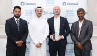 Ooredoo, Senior Director Business Accounts, Hassan Al Emadi with other officials during the award ceremony.