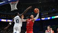Canada's Dillon Brooks (R) lays up against USA's Anthony Edwards during the FIBA Basketball World Cup game for third place between USA and Canada in Manila on September 10, 2023. Photo by Ted ALJIBE / AFP