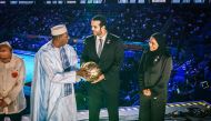 Haman Niang, President of the International Basketball Federation handed the ball for the 2027 FIBA ​​World Cup to Mohamed Al Maghaiseeb, President of the Qatar Basketball Federation, and Sheikha Asma Al Thani, Director of Marketing and Communication Department of the Qatar Olympic Committee during a ceremony on the sidelines of the 2023 FIBA ​​World Cup closing ceremony in Manila, Philippines, on  September 10, 2023.