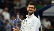 Serbia's Novak Djokovic poses with the trophy after defeating Russia's Daniil Medvedev in the US Open tennis tournament men's singles final match at the USTA Billie Jean King National Tennis Center in New York on September 10, 2023. (Photo by ANGELA WEISS / AFP)
