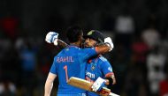 India's KL Rahul (left) celebrates with teammate Virat Kohli after scoring a century (100 runs) during the Asia Cup 2023 super four one-day international (ODI) cricket match between India and Pakistan at the R. Premadasa Stadium in Colombo on September 11, 2023. (Photo by Farooq Naeem / AFP)