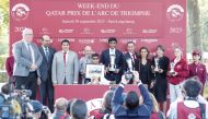 Qatar Racing and Equestrian Club's Board Member Khalifa bin Mohammed Al Attiyah (second left) presented the trophies to the winners of the Gr1 PA Qatar Arabian Trophy Des Juments after Olivier Peslier guided Al Shaqab Racing's Nour Al Maury to victory, yesterday. 