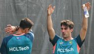 Australia's captain Pat Cummins (R) attends a practice session ahead of the 2023 ICC men's cricket World Cup one-day international (ODI) match between India and Australia at the MA Chidambaram Stadium in Chennai on October 6, 2023. (Photo by R. Satish Babu / AFP) 