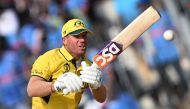 Australia's David Warner plays a shot during the 2023 ICC Men's Cricket World Cup one-day international (ODI) match between India and Australia on October 8, 2023. (Photo by Punit Paranjpe / AFP)