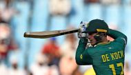 South Africa's Quinton De Kock rests during the 2023 ICC Men's Cricket World Cup one-day international (ODI) match between Australia and South Africa at the Ekana Cricket Stadium in Lucknow on October 12, 2023. (Photo by TAUSEEF MUSTAFA / AFP)
