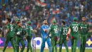 Bangladesh's players greet India's Virat Kohli (C) after India won the 2023 ICC Men's Cricket World Cup one-day international (ODI) match against Bangladesh at the Maharashtra Cricket Association Stadium in Pune on October 19, 2023. (Photo by Punit PARANJPE / AFP) 