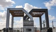 This picture taken on October 19, 2023 shows a view of the gate to the Rafah border crossing with Egypt in the southern Gaza Strip. Photo by MOHAMMED ABED / AFP