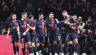 PSG’s players celebrate during the UEFA Champions League Group F match against AC Milan, in Paris, yesterday. AFP
