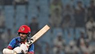 Afghanistan's captain Hashmatullah Shahidi plays a shot during the 2023 ICC Men's Cricket World Cup one-day international (ODI) match between Netherlands and Afghanistan at the Ekana Cricket Stadium in Lucknow on November 3, 2023. (Photo by Arun SANKAR / AFP)