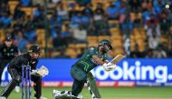 Pakistan's Fakhar Zaman (R) plays a shot during the 2023 ICC Men's Cricket World Cup one-day international (ODI) match between New Zealand and Pakistan at the M. Chinnaswamy Stadium in Bengaluru on November 4, 2023. (Photo by Sajjad HUSSAIN / AFP)