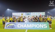 Asia Rugby President Qais Abdulla Al Dhalai and Qatar Rugby and Hockey Committee Chairman Yousef Jaham Al Kuwari with players and officials of Thailand, champions of the 2023 Asia Rugby Sevens Trophy in Doha.