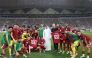 Qatar strikers Almoez Ali (right) and Akram Afif holding jerseys to mark their 100th international-match milestones along with  Qatar Football Association President Jassim Rashid Al Buenain and Qatar head coach Carlos Queiroz besides teammates.