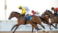 Jockey Tomas Lukasek guides Al Rabban Racing’s Harb towards the finish line to win the Ras Al Noof Cup, yesterday. Pic: Juhaim/QREC