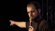 Video grab taken from an AFP footage dated November 27, 2023 shows Russian comic Dan the Stranger performing on stage in a club in Munich, southern Germany. (Photo by Pauline Curtet / AFP)
