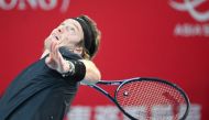 Russia's Andrey Rublev serves to China's Shang Juncheng during their men's semi-final singles tennis match at the Hong Kong Open in Hong Kong on January 6, 2024. (Photo by Peter Parks / AFP)
