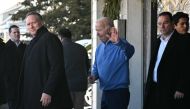 US President Joe Biden waves while stepping out of a restaurant after breakfast with First lady Jill biden (out of frame) in Rehoboth Beach, Delaware, on January 21, 2024. (Photo by Mandel NGAN / AFP)
